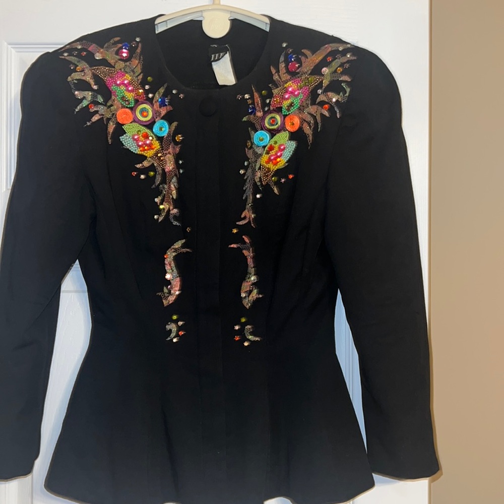 Women’s jacket - original Size 10, professionally taken in to a size 2.